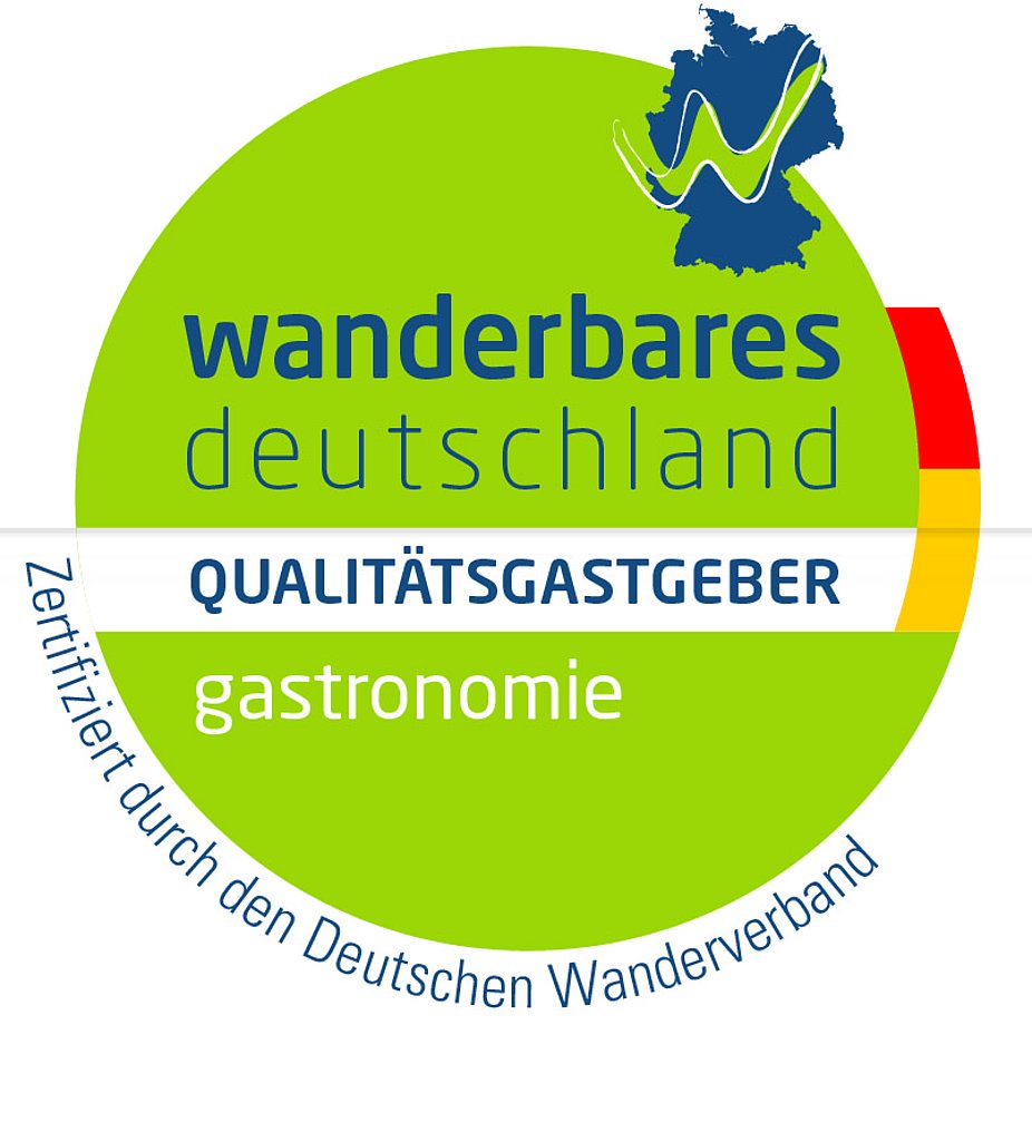 Grüner Kreis als Logo für Qualitätsgastgeber wanderbares Deutschland